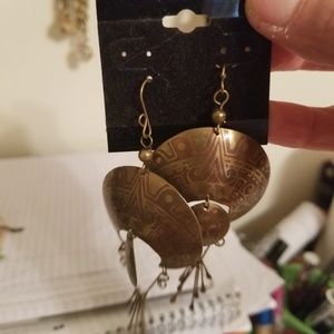 Dangling earrings with tribal designs